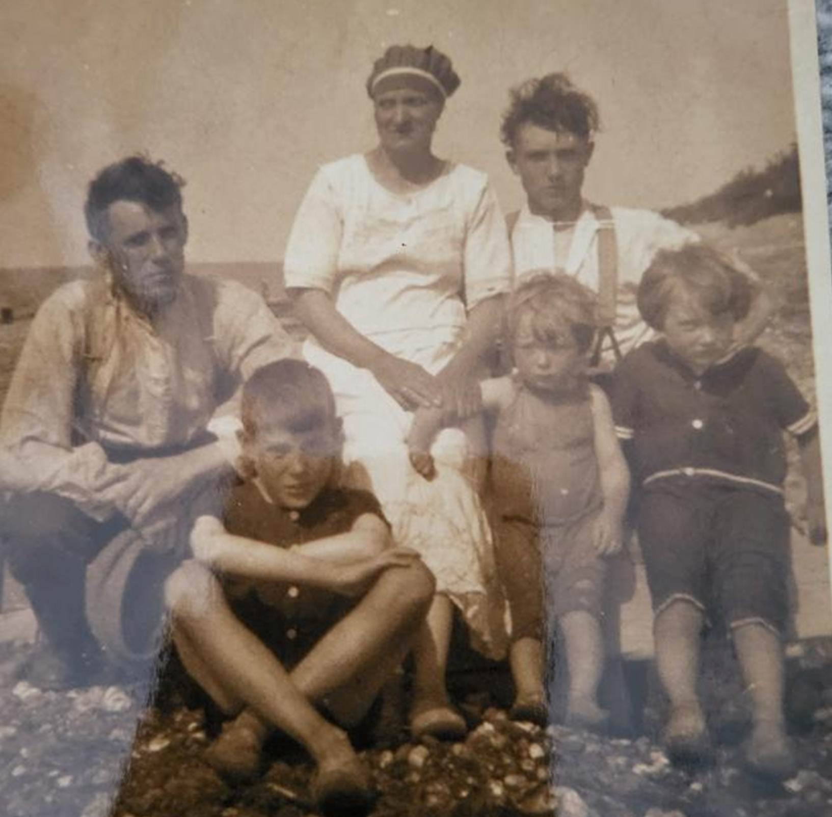 A family photo of a person and person and children

Description automatically generated